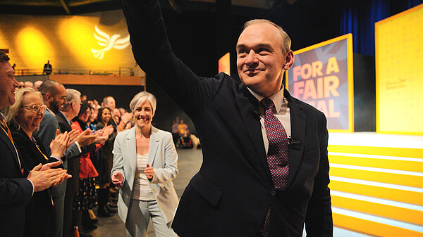 Ed Davey waves to the crowd after his speech to Liberal Democrat Conference