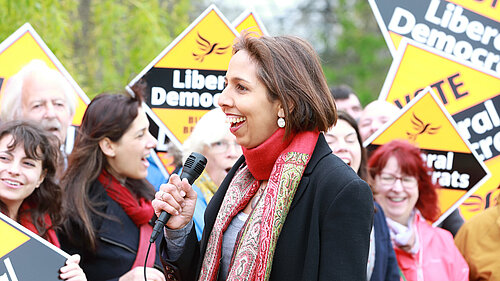 Munira Wilson speaks in front of a crowd