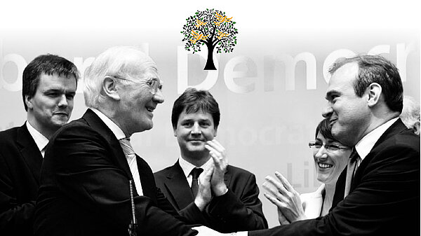 Black and white photo of Liberal Democrats, including Menzies Campbell, Nick Clegg and Ed Davey, and the Legacy Society logo